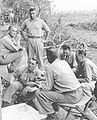 Lieutenant Colonel, later Colonel, Bill Whaling (lower left looking at map) photographed on Guadalcanal in August or September, 1942. Waling led the Whaling Group of scouts and snipers during the Guadalcanal campaign.