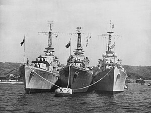 HMAS Warramunga (D123), HMCS Nootka (DDE 213) and HMS Cockade (D34) at anchor, in 1951 (NH 97046).jpg