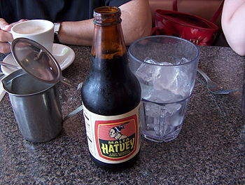 A bottle of Malta next to a glass of ice HPIM0351.JPG