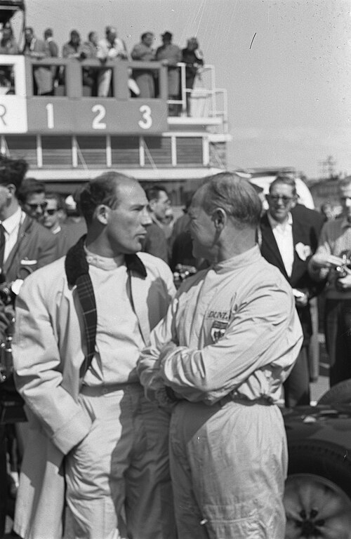 Moss (left) with Innes Ireland at the 1961 Dutch Grand Prix