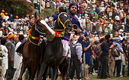 Anandpur Sahib is the site for the annual Hola Mohalla gathering and martial sports. Hola Mohalla Holi festival and sports, Anandpur Sahib Punjab India.jpg