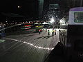 The Isle of Wight Festival 2010 bus station, off Fairlee Road, Newport, Isle of Wight seen at night. A number of Southern Vectis members of staff can be seen managing buses over the night, with buses brought in from various other operators on the mainland.