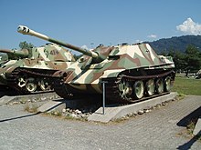 German designs from late World War II with well-sloped armour: the Jagdpanther tank destroyer and German Tiger II heavy tank in the background. Jagdpanther Thun 1.jpg