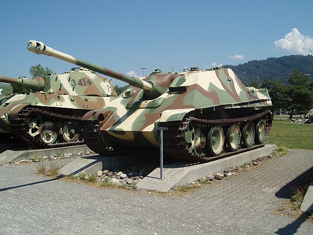 German designs from late World War II with well-sloped armour: the Jagdpanther tank destroyer and German Tiger II heavy tank in the background.