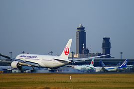Japan Airlines Boeing 787-8 is lading at Tokyo Narita Airport.