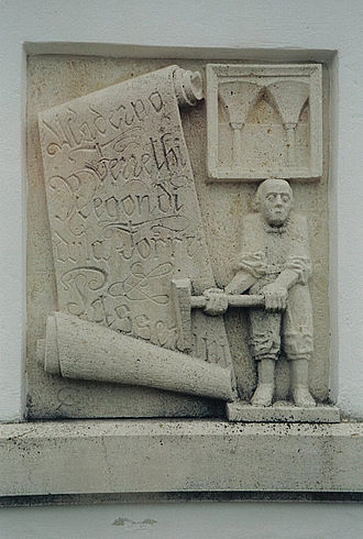 Stone relief carving of the Italian Master in Kaisersteinbruch. Scroll with the names Maderno, Ferrethi, Regondi, della Torre and Passerini, while to the upper right is a quotation from Neugebaude Castle. Kaisersteinbruch Italienische Meister.jpg