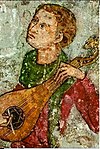 Medieval musician playing gittern.jpg