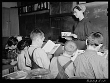 Mennonite teacher holding class in a one-room, eight-grade school house, Hinkletown, Pennsylvania, March 1942 Mennonite Classroom Pennsylvania 1942.jpg