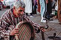 Moroccan playing with a cobra by Pseudolounge