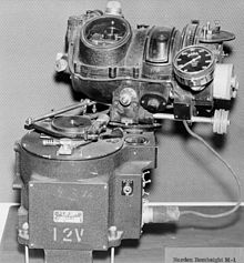 The Norden M-1 is the canonical tachometric bombsight. The bombsight proper is at the top of the image, mounted on top of the autopilot system at the bottom. The bombsight is slightly rotated to the right; in action the autopilot would turn the aircraft to reduce this angle back to zero. Norden M1 bombsight.jpg