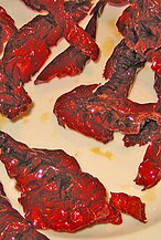 Peperoni cruschi are a type of dried peppers typical of the Italian Basilicata region. They are generally deep fried in olive oil for few seconds and consumed as a seasoning or served as vegetable chips.