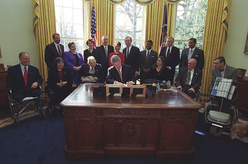 File:Photograph of President William Jefferson Clinton Signing Executive Order 13078, Increasing Employment of Adults with Disabilities, in the Oval Office - NARA - 6037503.jpg