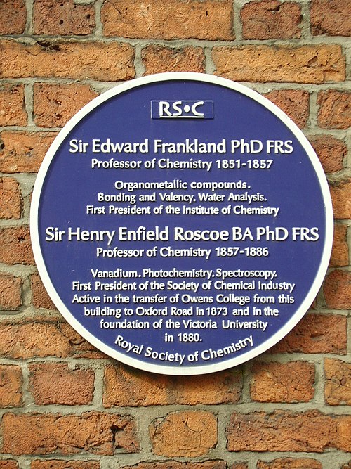 A blue plaque erected Quay Street, Manchester