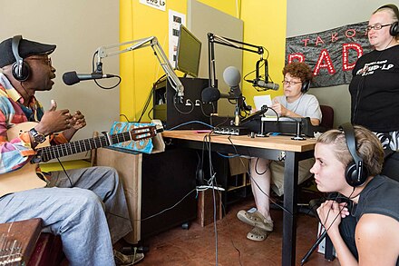 A musician interviewed in a radio studio