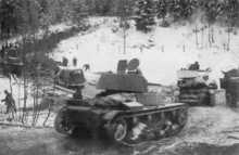 Soviet T-26 light tanks (mod. 1939 and mod. 1933), GAZ-M1 car and GAZ-AA trucks of the 7th Army during its advance on the Karelian Isthmus. 2 December 1939.