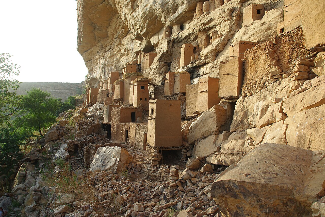 A Dogon village nestled within the sandstone cliffs of the Bandiagara Escarpment