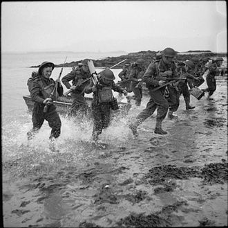 Men of the 7th Battalion, Royal Northumberland Fusiliers charge ashore during invasion exercises at Greencastle, County Down in Northern Ireland, 8 May 1942. The British Army in the United Kingdom 1939-45 H19575.jpg