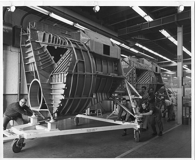 Two Grumman LM ascent fuselages being moved to final assembly.