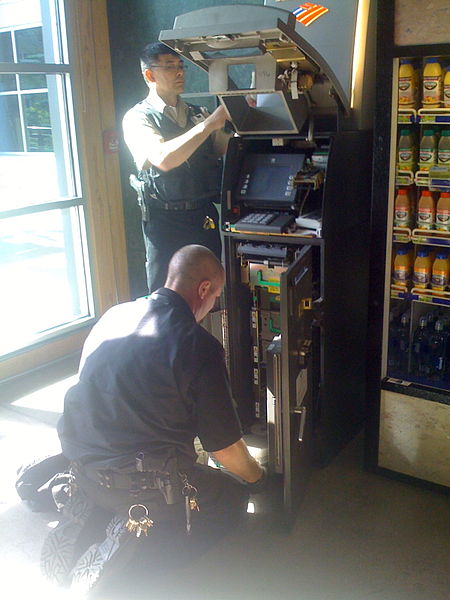 File:Two Loomis Employees Refilling an ATM at the Downtown Seattle REI.jpg