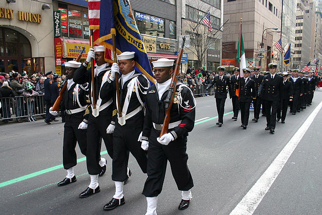 Members of Naval Reserve Center Bronx's color guard march up Fifth Avenue at the 244th Annual NYC St. Patrick's Day parade