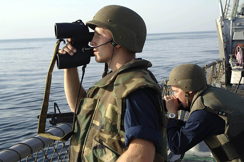 File:US Navy 060202-N-8298P-009 Gunner's Mate 2nd Class John Kraska, left, and Torpedoman's Mate 2nd Class Corey Opalka stands watch during small boat attack training.jpg