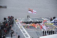 The Indian Navy ensign is hoisted aboard Vikramaditya as she is commissioned at Sevmash Shipyard in Russia.