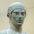 Charioteer of Delphi, wearing a fillet headband, bronze statue (478–474 BCE).