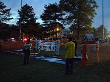 Falun Gong protesters inside a fenced-off free speech zone at the 2000 Presidential Debate at Washington University in St. Louis Washington University Public Zones2.jpg