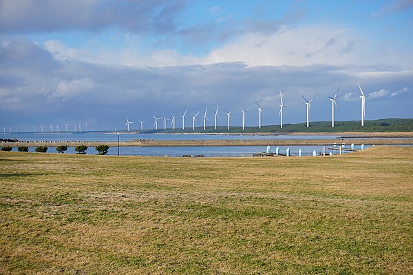 Wind turbines lined up along the coast of Katagami City