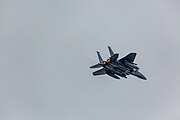 An F-15E Strike Eagle, tail number 91-0302, taking off from RAF Lakenheath in England. The aircraft is assigned to the 492nd Fighter Squadron.