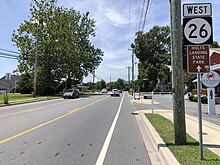 DE 26 westbound in Millville 2022-07-08 13 18 05 View west along Delaware State Route 26 (Atlantic Avenue) just west of Old Mill Road in Millville, Sussex County, Delaware.jpg