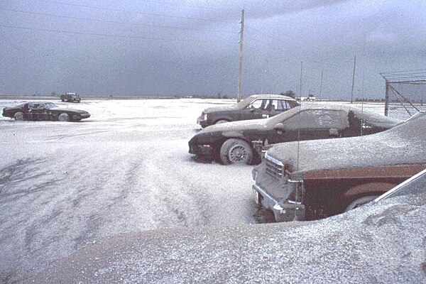 Snow-like blanket of Mount Pinatubo's ashfall deposits in a parking lot on Clark Air Base (June 15, 1991)