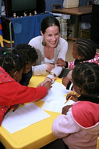 Biden playing with children at the Mapetla Day Care Centre in Soweto, South Africa during an official visit in June 2010 Ashley Biden Plays Games With South African Children (4690981899).jpg