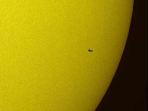 An image of the Space Shuttle Atlantis as it transits the Sun Atlantis silhouette.jpg