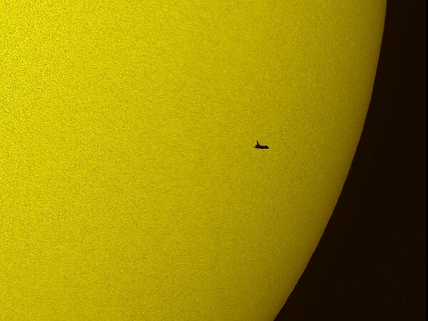 Space Shuttle Atlantis as it transits the Sun