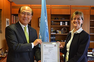 BSI representative presenting a standards certification to the International Maritime Organization in 2018 BSI presentation to International Maritime Organization for re-certification of IMO Information Security Management to ISO 27001.jpg