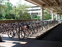 Bicycle parking at the Alewife subway station in Cambridge, Massachusetts, located at the intersection of three cycle paths Bicycle parking at Alewife station, August 2001.jpg