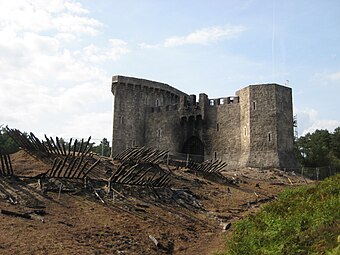 Mock castle at the Bourne Wood at the end of filming, showing the burnt-out castle gate