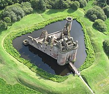 Caerlaverock Castle in Scotland is surrounded by a moat. Caerlaverock Castle from the air 1.jpeg