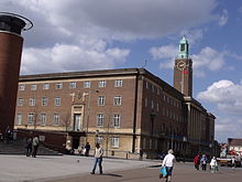 large brick building with a tall clock tower