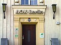 Köpenick coat of arms on a building of the AOK insurance