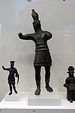 Copper-alloy of Horus (centre) as a Roman officer with contrapposto stances (National Archaeological Museum, Athens)