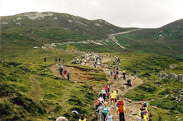 Pilgrims climbing Croagh Patrick on Reek Sunday. It is believed that climbing hills and mountains has formed a major part of the festival since ancien