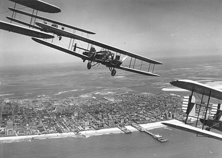 Curtiss B-2 Condor formation flight over Atlantic City, N.J. S/N 28-399 is in the foreground (tail section only). Aircraft were assigned to 11th Bombardment Squadron, 7th Bombardment Group at Rockwell Field, California. This flight of 4 aircraft completed cross-country flight to Atlantic City, NJ