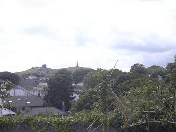 Carn Brea, seen from Redruth. Carn Brea Castle and Monument are visible at the top of the hill.