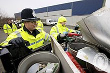 Police in the United Kingdom check a scrap van for questionable items. Day 148 - West Midlands Police - Tackling Metal Theft (7267919656).jpg