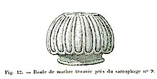 Black and white sketch of a sculptural element. The object is oval in shape and features longitudinal carvings.