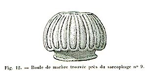 Black and white sketch of a sculptural element. The object is oval in shape and features longitudinal carvings.