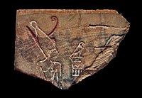 Fragment of an ivory label showing pharaoh Den wearing the double crown of Upper and Lower Egypt. Discovered in the tomb of Den, now in the Egyptian Museum. Den label.jpg