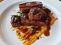 Dinner at the Greenbank Hotel, Falmouth - Seared lamb striploin, pressed lamb belly, spring greens, carrot potato bake, rosemary jus (40883295590).jpg